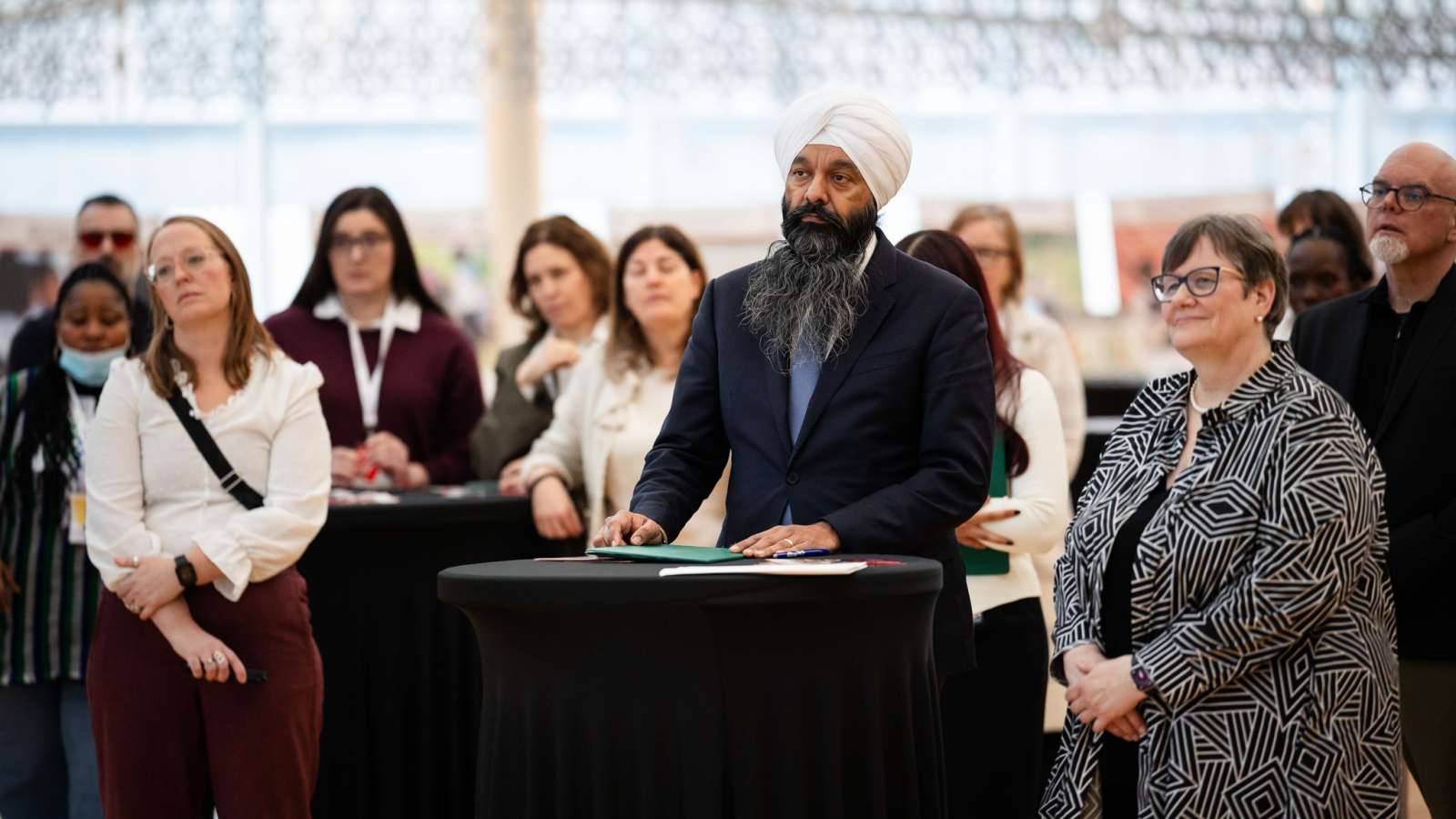 Minister speaking in front of the audience